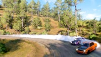 a car driving down a hill with smoke coming out of it